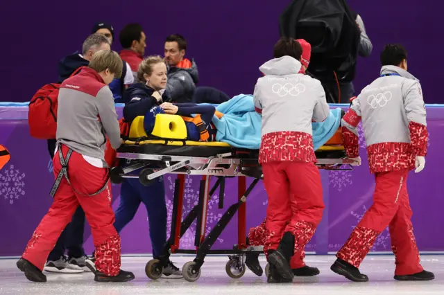 Great Britain's Elise Christie stretchered off the ice.