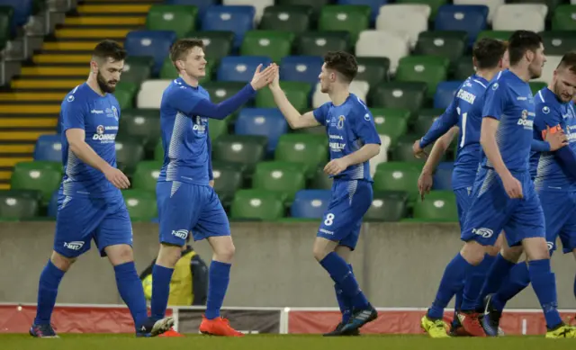 Ryan Mayse celebrates the first of his two goals for Dungannon Swifts in the opening half of the League Cup final.
