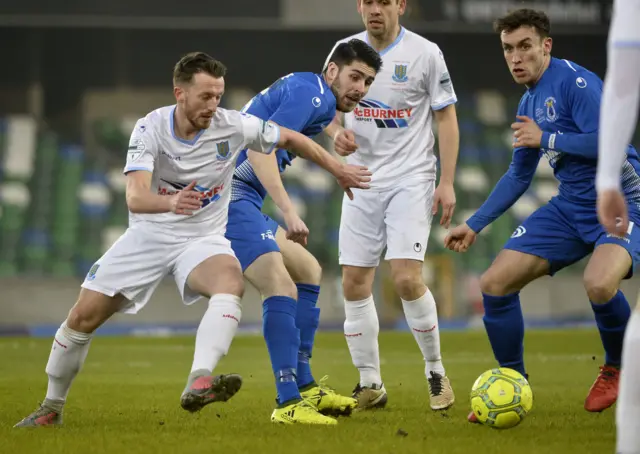Ballymena's Willie Faulkner battles for possession with Dungannon's Kris Lowe.