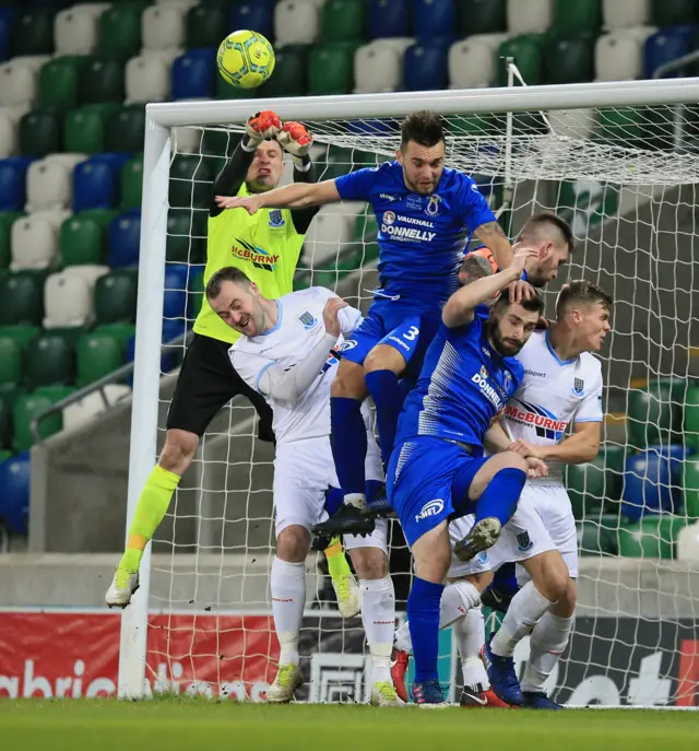 Ballymena goalkeeper Ross Glendinning punches clear during the League Cup final.