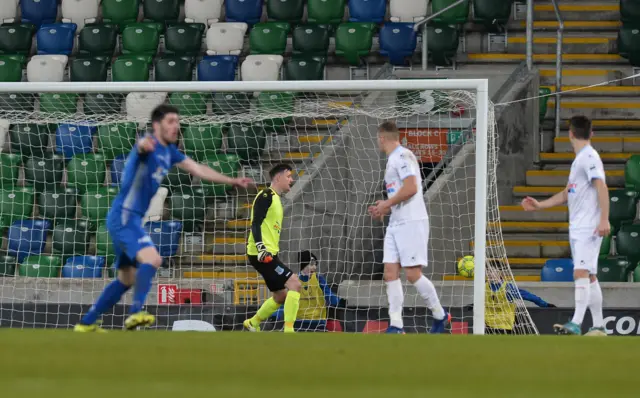 Is this the moment that Dungannon Swifts sealed their first trophy as a senior club? Ballymena goalkeeper Ross Glendinning can only watch on helplessly as Cormac Burke's shot puts Dungannon 3-1 ahead.