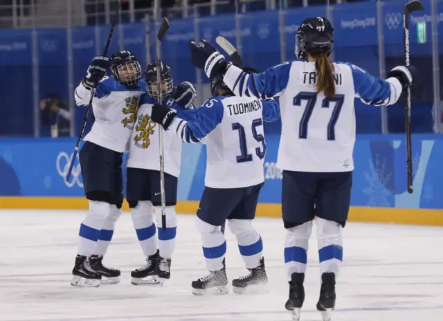 Finland's women's hockey team celebrate