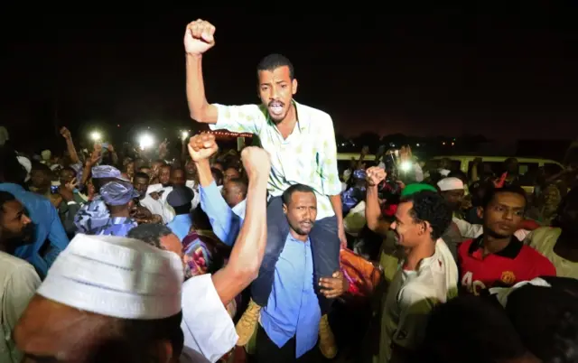 Supporters carry a released politician outside the National Prison, after demonstrations in Khartoum, Sudan February 18, 2018.