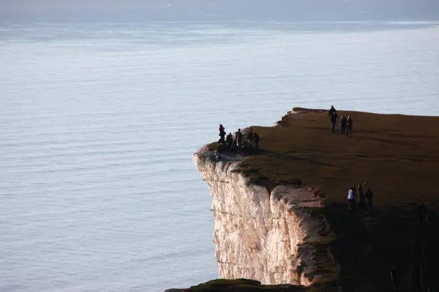 People were pictured near the edge of Birling Gap