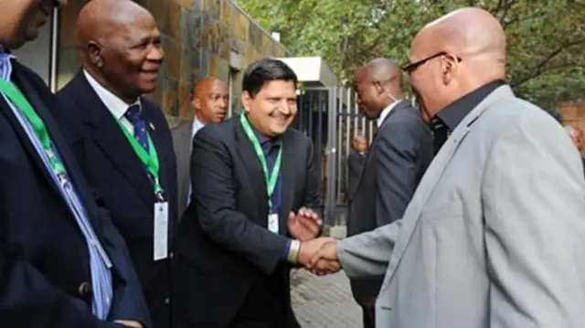 Atul Gupta (centre) shakes hands with President Jacob Zuma (right) in 2012. Their relationship has come under scrutiny in recent years