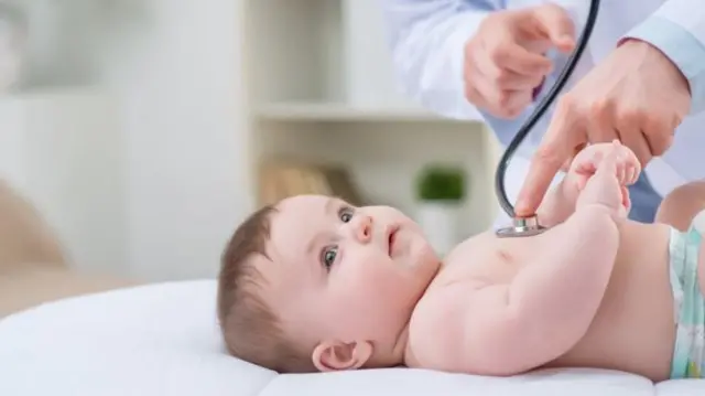 Baby being treated by doctor