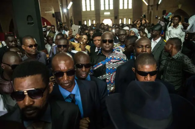 Felix Tshisekedi (Rear C), son of DR Congo"s late veteran opposition figurehead Etienne Tshisekedi, leaves after attending a memorial service on February 1, 2018 in Kinshasa