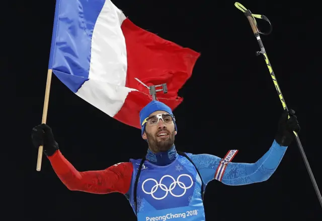 Martin Fourcade celebrates