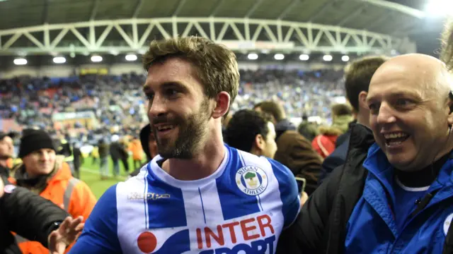 Will Grigg celebrates