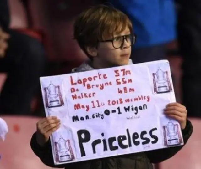 A young Wigan fan makes his point