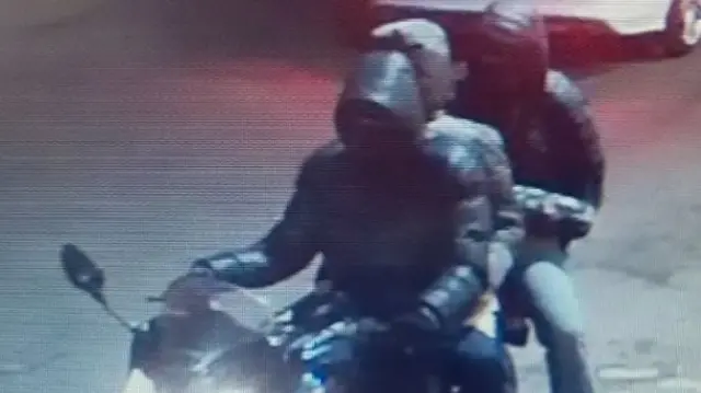 Men on a motorbike on CCTV