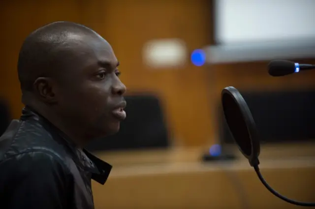 Ivorian Ali Ouattara, 45, sits in court during his trial in Ceuta, a Spanish overseas territory in northern Morocco, on February 20, 2018.