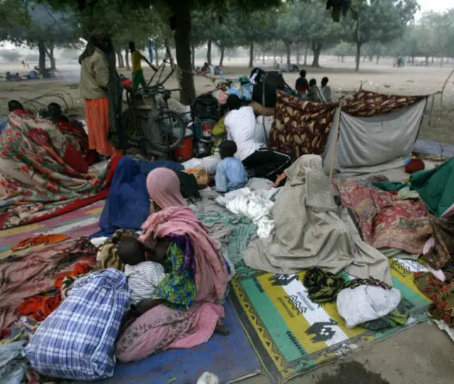 Chadian refugees wait 06 February 2008 in the Cameroonian border town of Kousseri after fleeing fighting between rebels and government forces in the Chadian capital of Ndjamena.