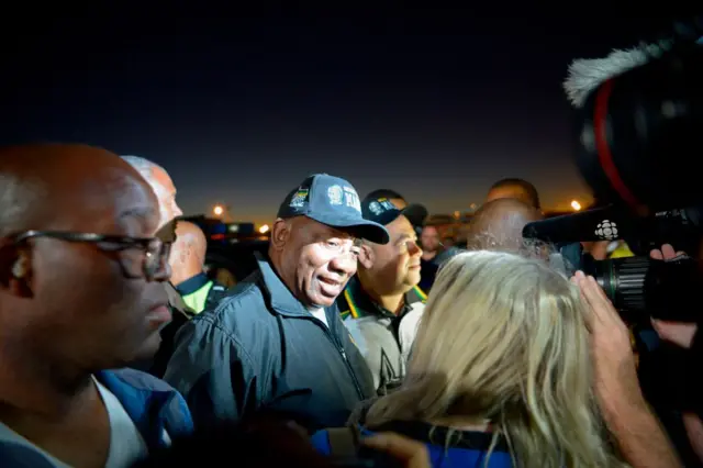 Cyril Ramaphosa flanked by other walkers