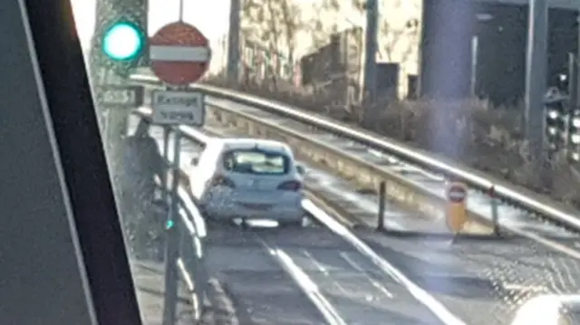 Car stuck on tram track