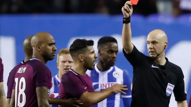 Anthony Taylor shows the red card to Fabian Delph