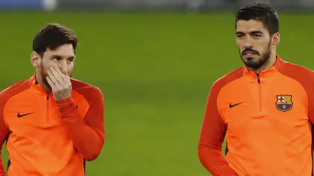 Lionel Messi (left) and Luis Suarez