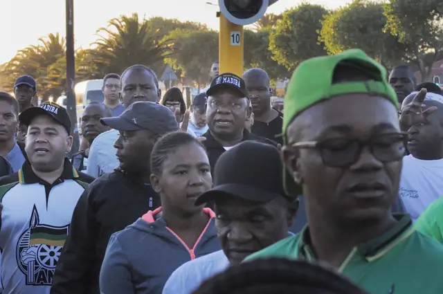 Cyril Ramaphosa flanked by other walkers