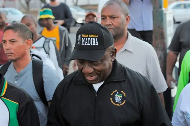 Cyril Ramaphosa flanked by other walkers