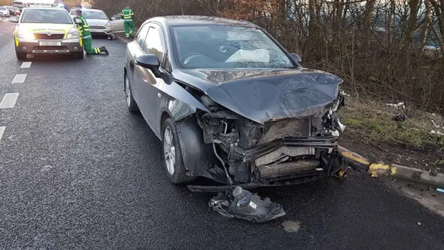 Smashed up car on A38