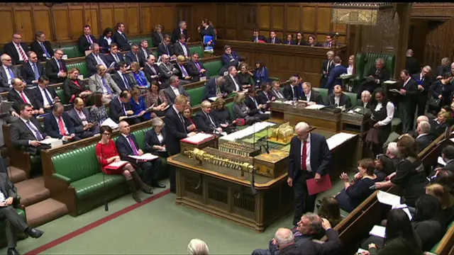 Chamber with Jeremy Corbyn walking ni