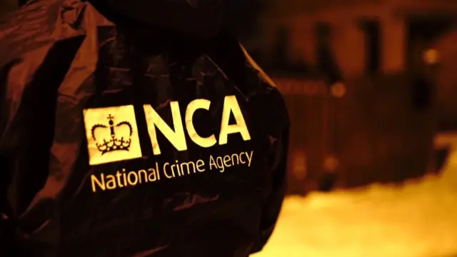 Back of a National Crime Agency officer