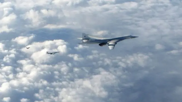 Two Russian Blackjack Tupolev Tu-160 long-range bombers followed by a British Royal Air Force (RAF) Typhoon aircraft (L) scrambled from RAF Lossiemouth, Scotland, 15 January 2018