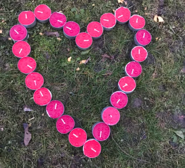 Heart shape made out of candles