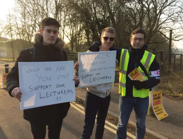 Students James Duff and Lawrence Pople with striking lecturer David Huyssen