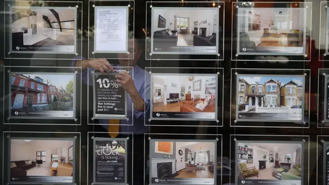 Adverts in an estate agent's window