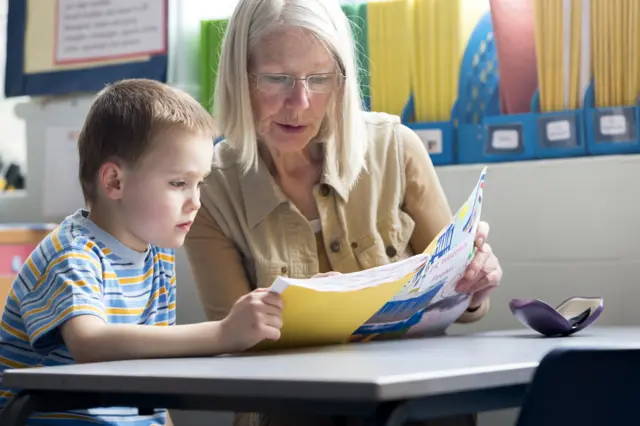 Child reading in class