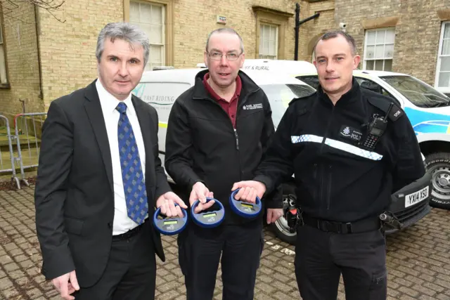 Councillor Shaun Horton, portfolio holder for community involvement and local partnerships at East Riding of Yorkshire Council, Stuart Allen, the council's senior Dog Warden and Humberside Police's PC Brandon Ward