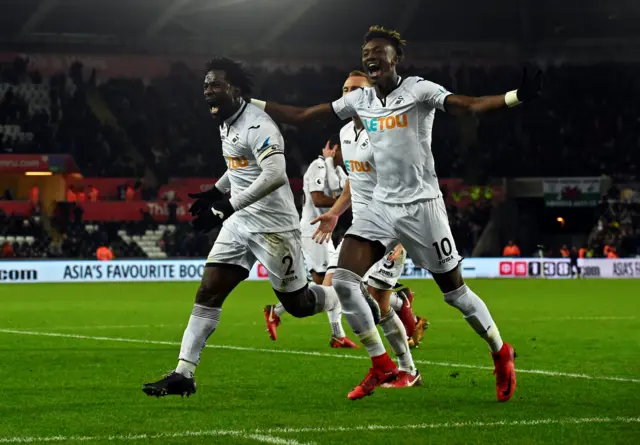 Swansea players celebrate a goal