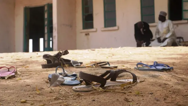 Sandals are strewn in the yard of the Government Girls Science and Technical College staff quarters in Dapchi, Nigeria, on February 22, 2018