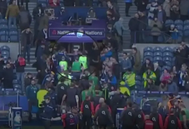 Players clash at the entrance to the tunnel before kick-off