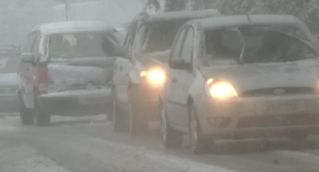 Cars driving in the snow