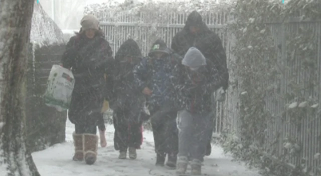 People walking in heavy snow