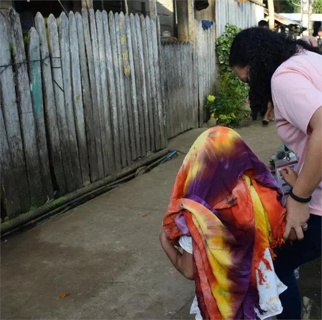 Child being rescued in the Philippines