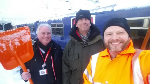 Staff clearing snow