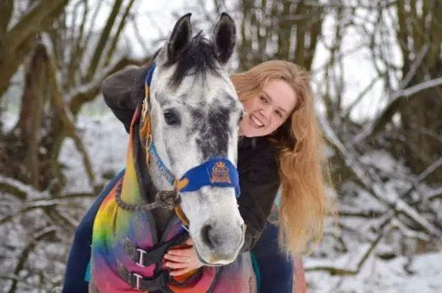 Girl rides horse