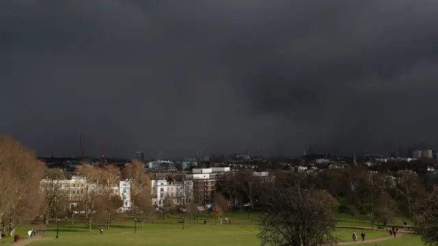 Storm clouds are seen from Primrose Hill in London