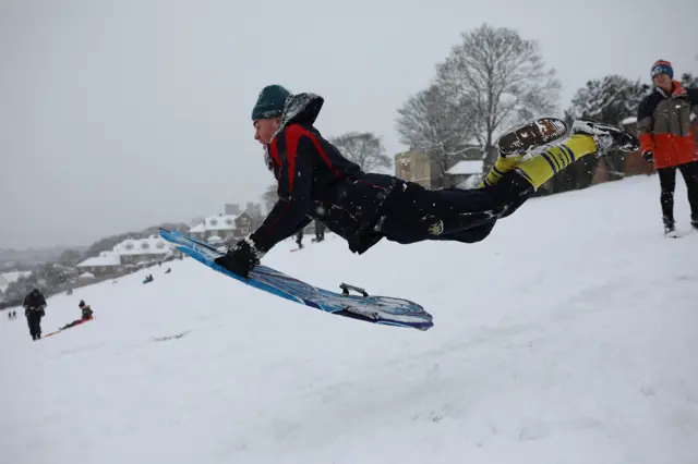 Young man with sledge