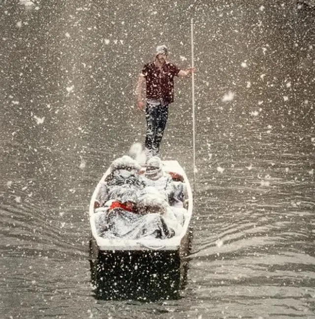 Punter in the snow in Cambridge