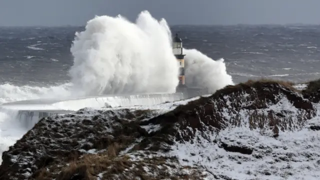 Waves crashing againsy Seaham lighthouse