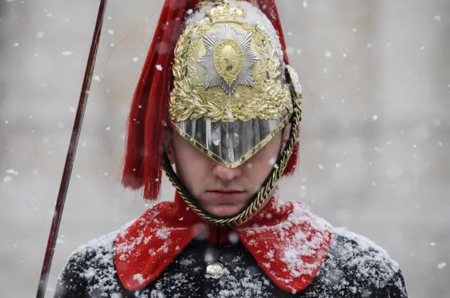 Household Cavalry guard in the snow, London