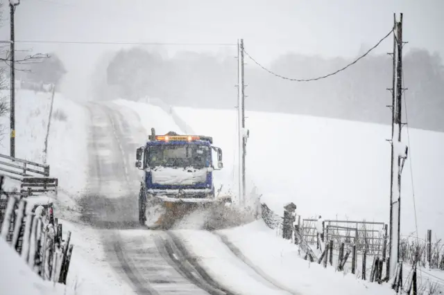 Snow plough on small road