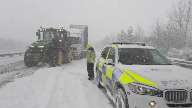 Tractor helping in the snow