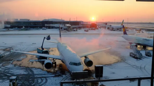 The sun rising over Heathrow airport which saw snowfall overnight