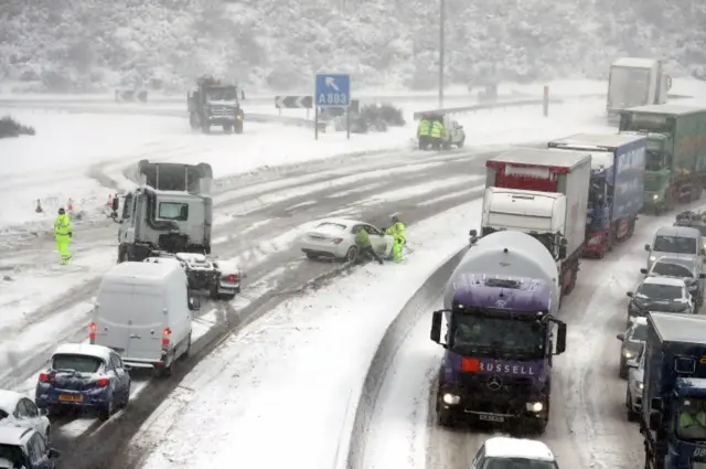 Police push a car on the on the M80 Haggs in Glasgow