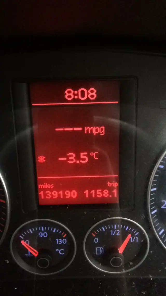 In car thermometer shows a reading of minus 3.5